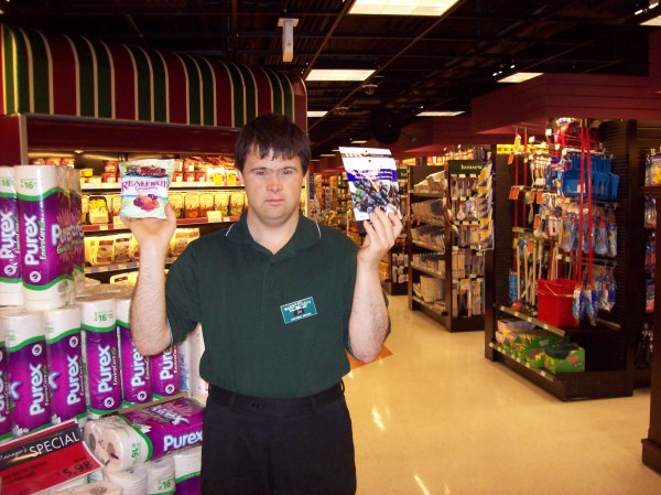 Jai holding up some of the things they sell in the IGA